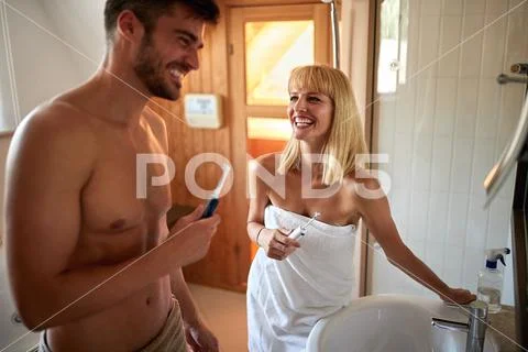 Happy couple doing dental hygiene Stock Photos