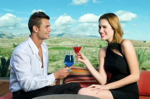 Happy couple drinking Stock Photos
