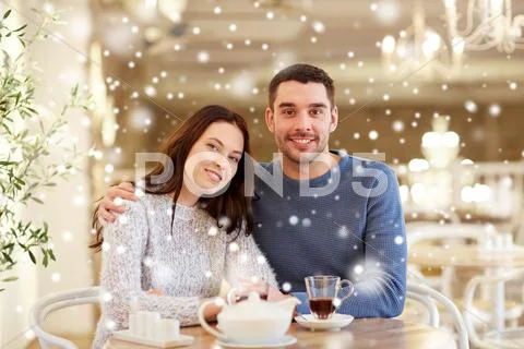 Happy couple drinking tea at restaurant Stock Photos