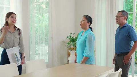 Happy couple elderly looking new home while agent real estate explaining an.. Stock Footage 255500683