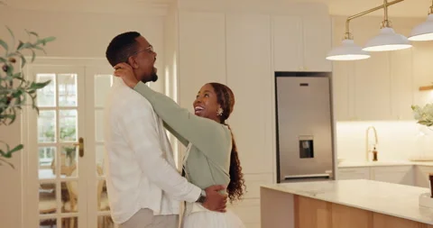 Happy couple, embrace and dancing in kitchen, commitment and celebration for Stock Footage 337541519