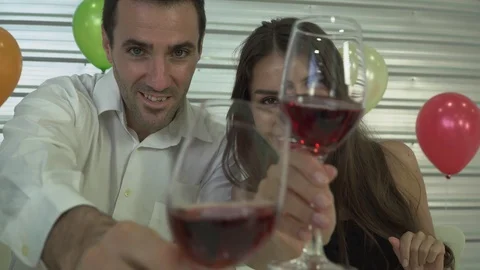 A happy couple enjoy drinking red wine in New Year's festival at home. Stock Footage 120023799