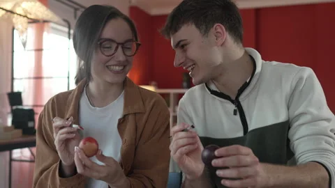 Happy couple enjoy while paint decorative easter egg in living room Stock-Footage 301916656