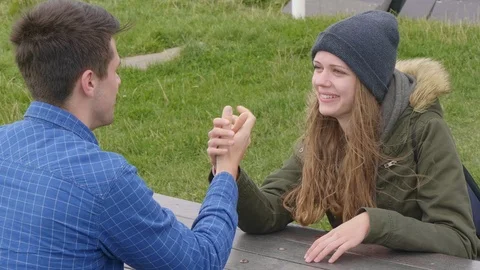 Happy couple has fun by doing arm-wrestling 動画素材 95559677