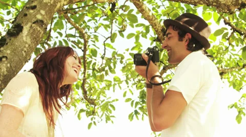 Happy couple has fun taking pictures Stock Footage 33869455