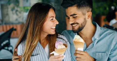 Happy couple having date and eating ice cream Stock Footage 77845429