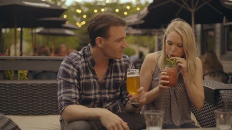 Happy Couple having Drinks on Date 2 Stock Footage 92548589