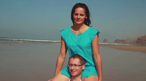 Happy couple having fun on the beach, slow motion, steadicam shot Видео 10892166