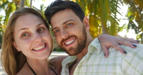 Happy couple having fun on the beach Stock Footage 58957996