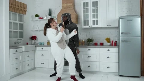 Happy couple having fun dancing and singing indoor Stock-Footage 148687328