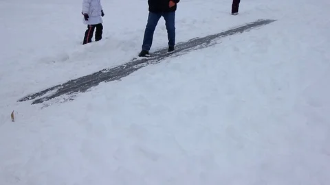 Happy couple having fun ice skating on rink outdoors. Winter sport and leisure Stock Footage 71437443