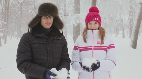 Happy couple having fun together throwing snow Stock Footage 72302504