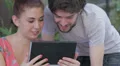 happy couple having fun using webcam of a tablet computer HD Footage
