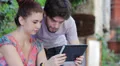 happy couple having fun using a tablet computer HD Footage