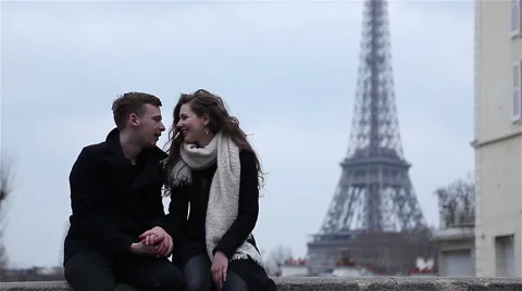Happy couple having a good time in Paris at the Eiffel Tower Stock Footage 64055017