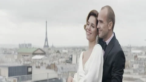 Happy couple having a good time in Paris at the Eiffel Tower. Action. Happy Stock Footage 224560546