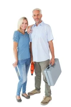Happy couple holding DIY tools Stock Photos