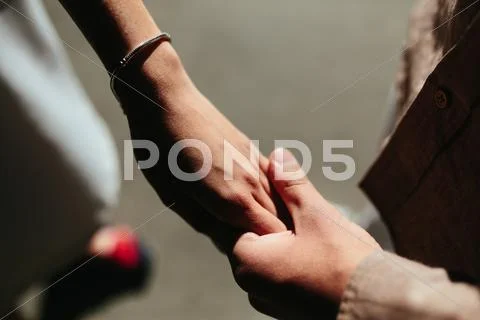 Happy couple holding hands Stock Photos