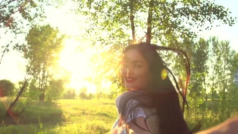Happy couple holding hands, running on field and having fun outdoors Stock Footage
