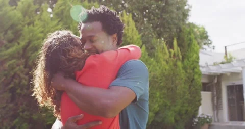 Happy couple hugging each other after proposal in garden Stock Footage 339555733