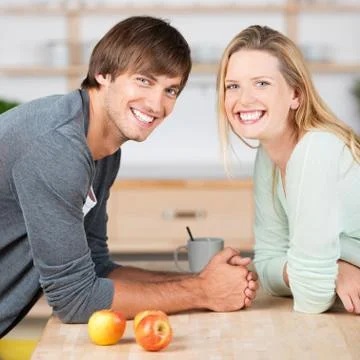 Happy couple in the kitchen Stock Photos