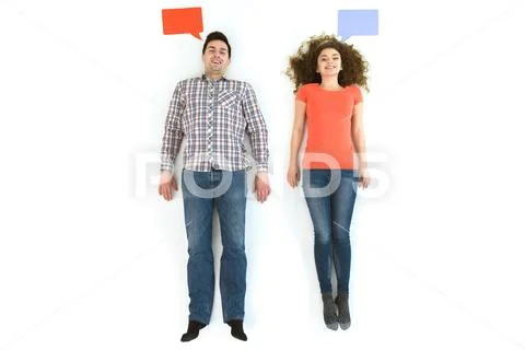 The happy couple lay near the dialog signs. View from above Stock Photos