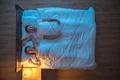 The happy couple lie on the bed. evening night time. view from above Photo