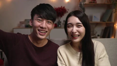 Happy couple look at camera talking on video call Video stock 164839284