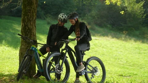Happy Couple Looking at the Bicycle Odometer Stock Footage 252396556