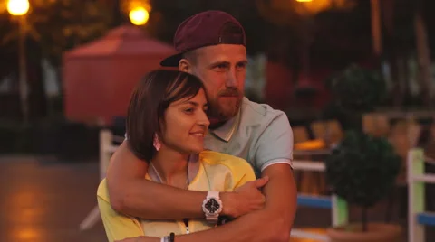 Happy couple looking at a fire Stock Footage 68539041