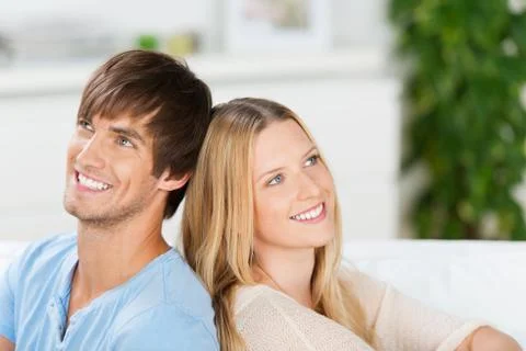 Happy couple looking up Stock Photos