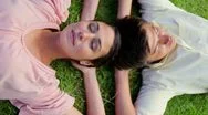 Happy Couple Lying Together On The Grass Stock Footage