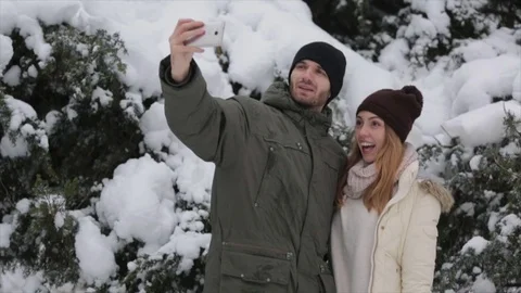 A happy couple makes a selfie in winter Stock Footage 70222976