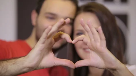 Happy couple making heart shape Stock Footage 45106813