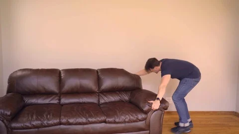 Happy Couple Moving Couch Stock Footage 92545213