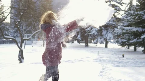 A happy couple playfully spends time in a winter park having fun on a snowy Stock Footage 162667121