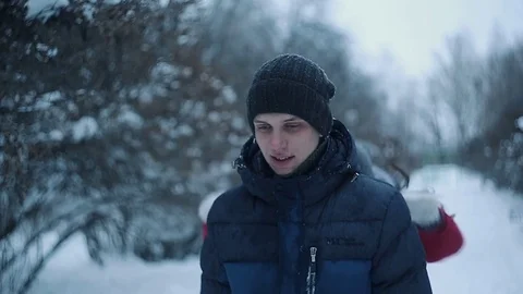 Happy couple playing and having fun the snowy forest during winter holidays. Stock Footage
