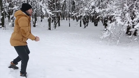 Happy couple playing in the snow Stock Footage 70139141