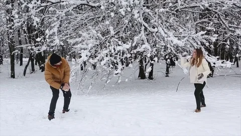 Happy couple playing in the snow Video stock 70139230