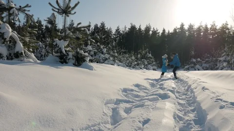 Happy Couple is Playing Winter Game Outside Enjoying Sunlight and Warm Winter Stock Footage 86570906