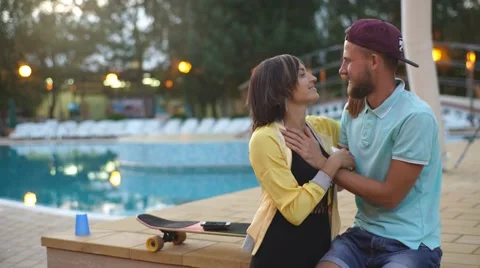 Happy couple by the pool Stock Footage 68538005