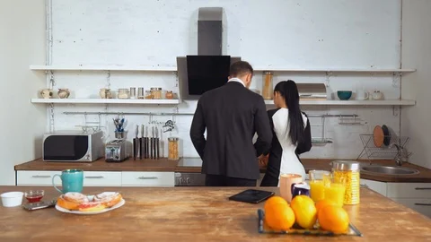 Happy couple preparing breakfast together Stock Footage 107401889