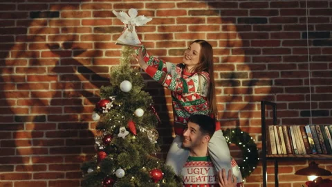 Happy couple preparing for New Year winter holidays celebration concept. Young Stock Footage 194592476