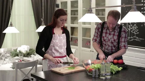 Happy couple preparing salad Stock-Footage 62795594