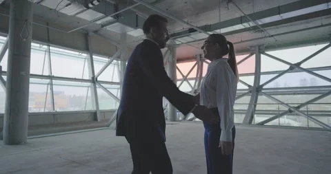 Happy couple renting empty loft for business and embracing Stock Footage 127155407