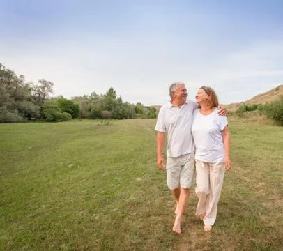 Happy couple running Stock Photos