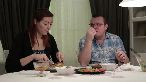 Happy couple sitting at the dinner table in a cafe Stock Footage 62873640