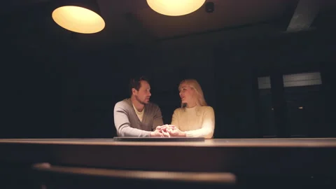 The happy couple sitting at the night empty bar. slow motion Stock Footage 168701550