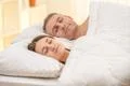 The happy couple sleeping on the bed Photo