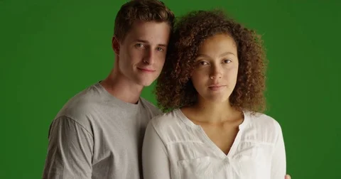 Happy couple smiling at home indoors on green screen Stock Footage